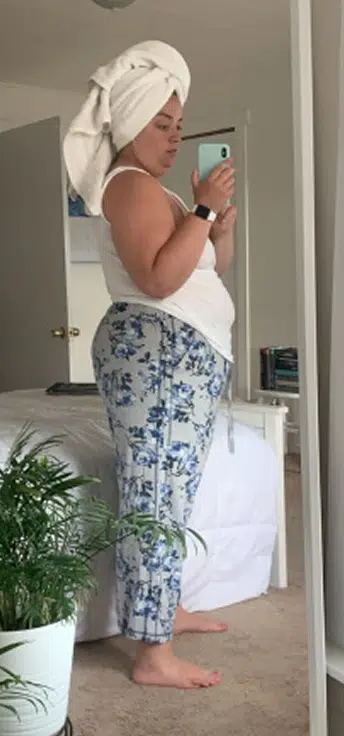 A woman taking a picture in the mirror